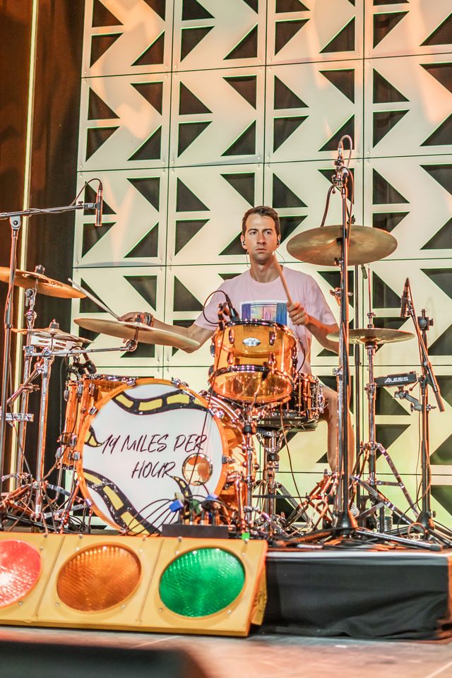 Drummer playing behind a Drums For Hour kit