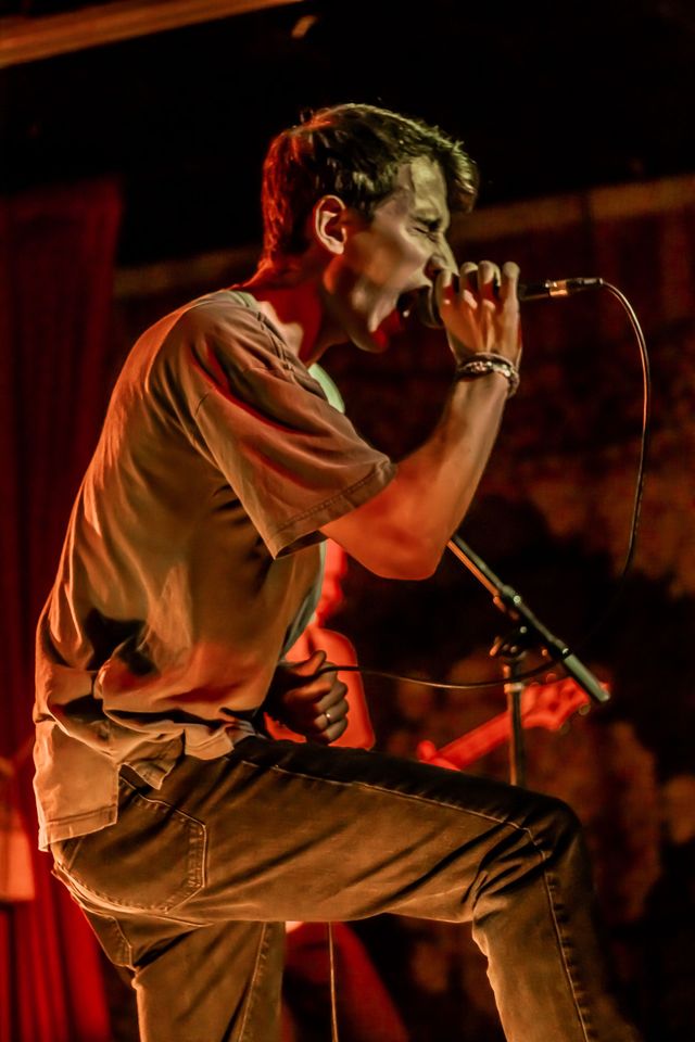 Vocalist singing into a microphone
